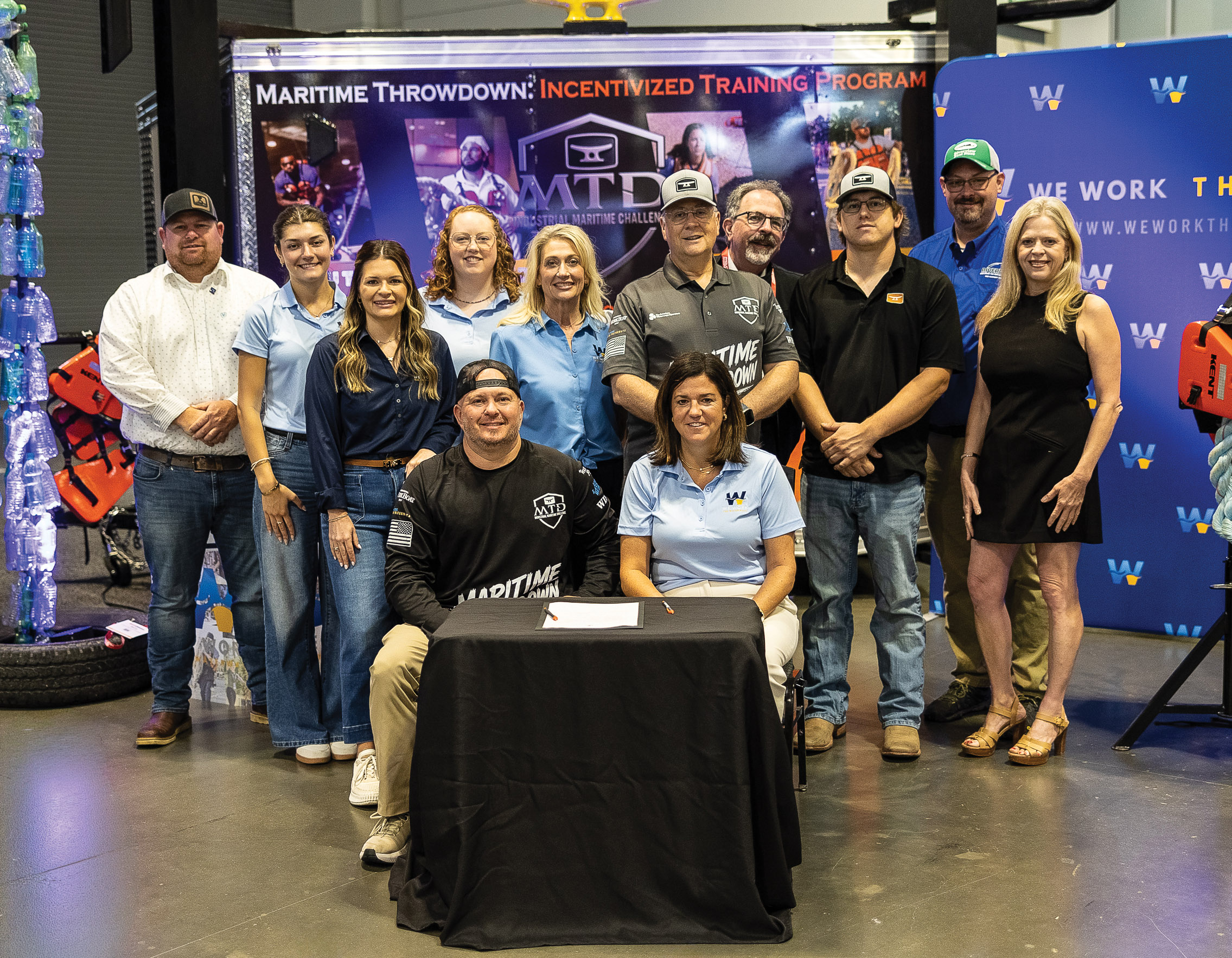 260615 IMX Workforce_b Representatives of We Work The Waterways and Maritime Throwdown gathered at the Inland Marine Expo (IMX) in Nashville, Tenn., following the signing of a memorandum of understanding formalizing a partnership aimed at advancing workforce development, maritime education and career awareness throughout the inland waterways industry.