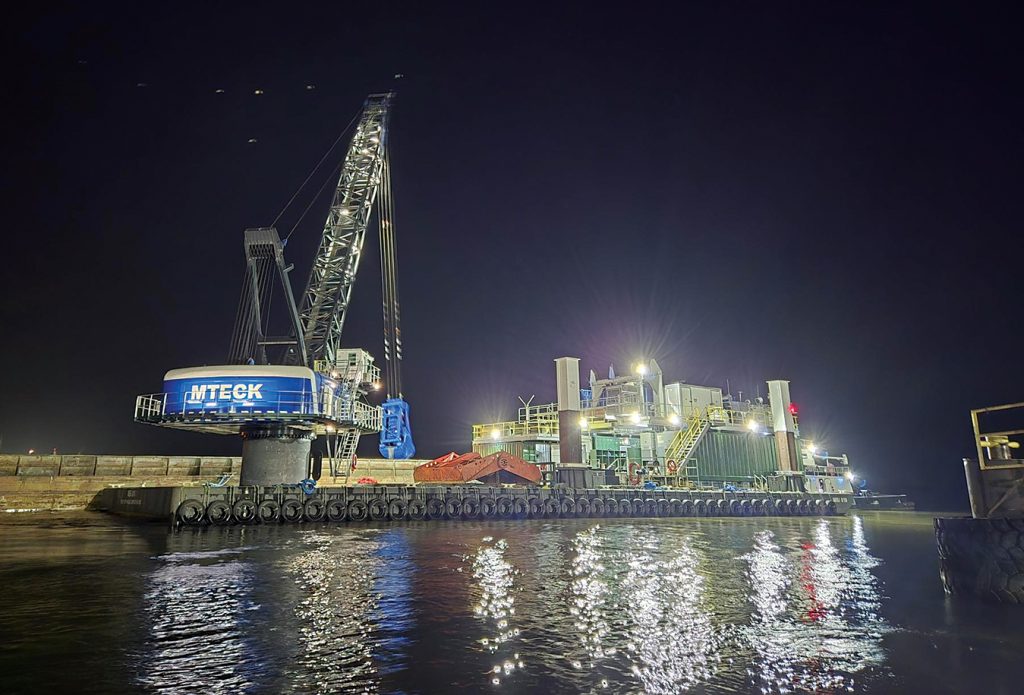 The MBI-10 all electric dredge works at night on the Houston Ship Channel. The ship channel operates 24 hours a day, and so does Matthews Brothers Dredging.