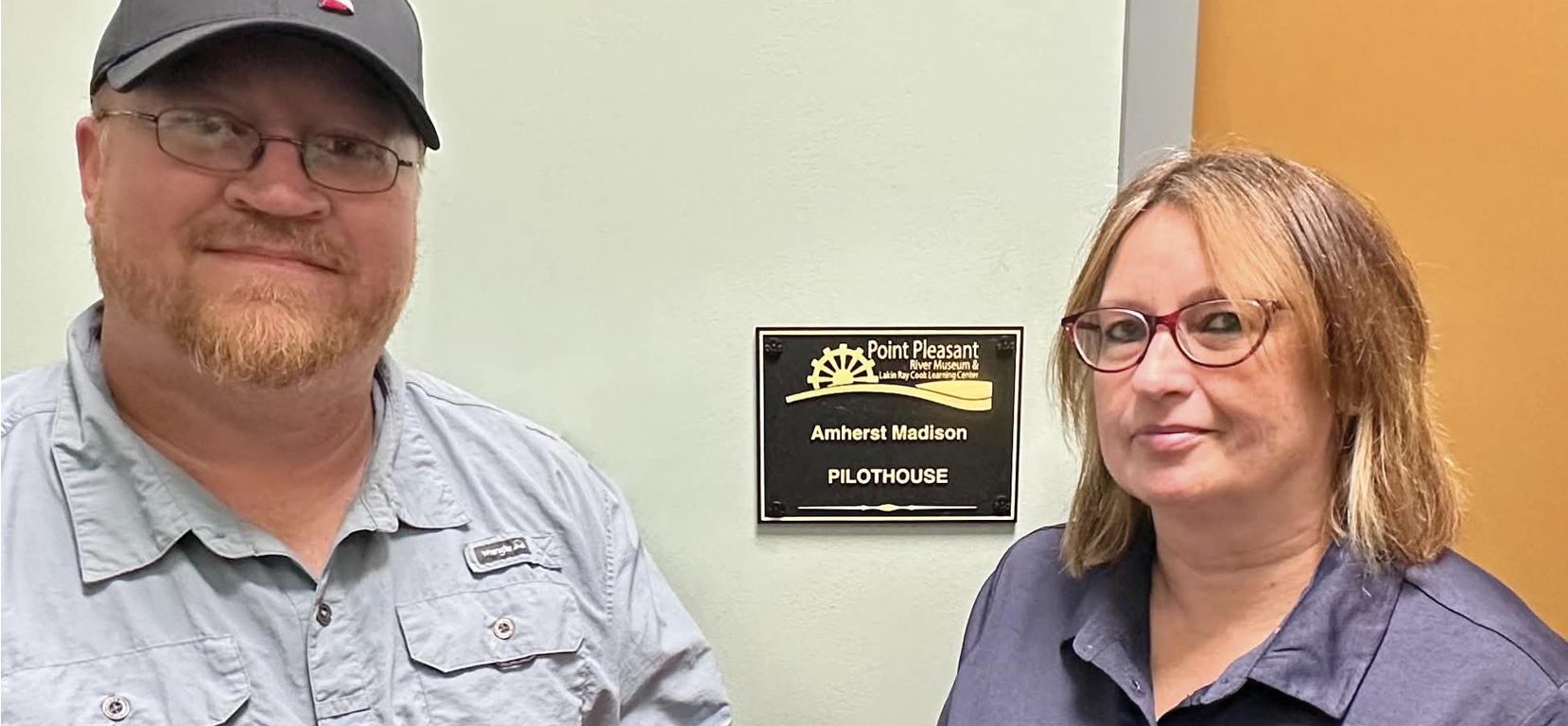 Capt. Brian Patterson, construction operations manager for Amherst Madison, presents a check to Dainna Mitchell, director of the Point Pleasant River Museum, to support the expansion of the museum’s simulator locations. (Photo courtesy of the Point Pleasant River Museum)