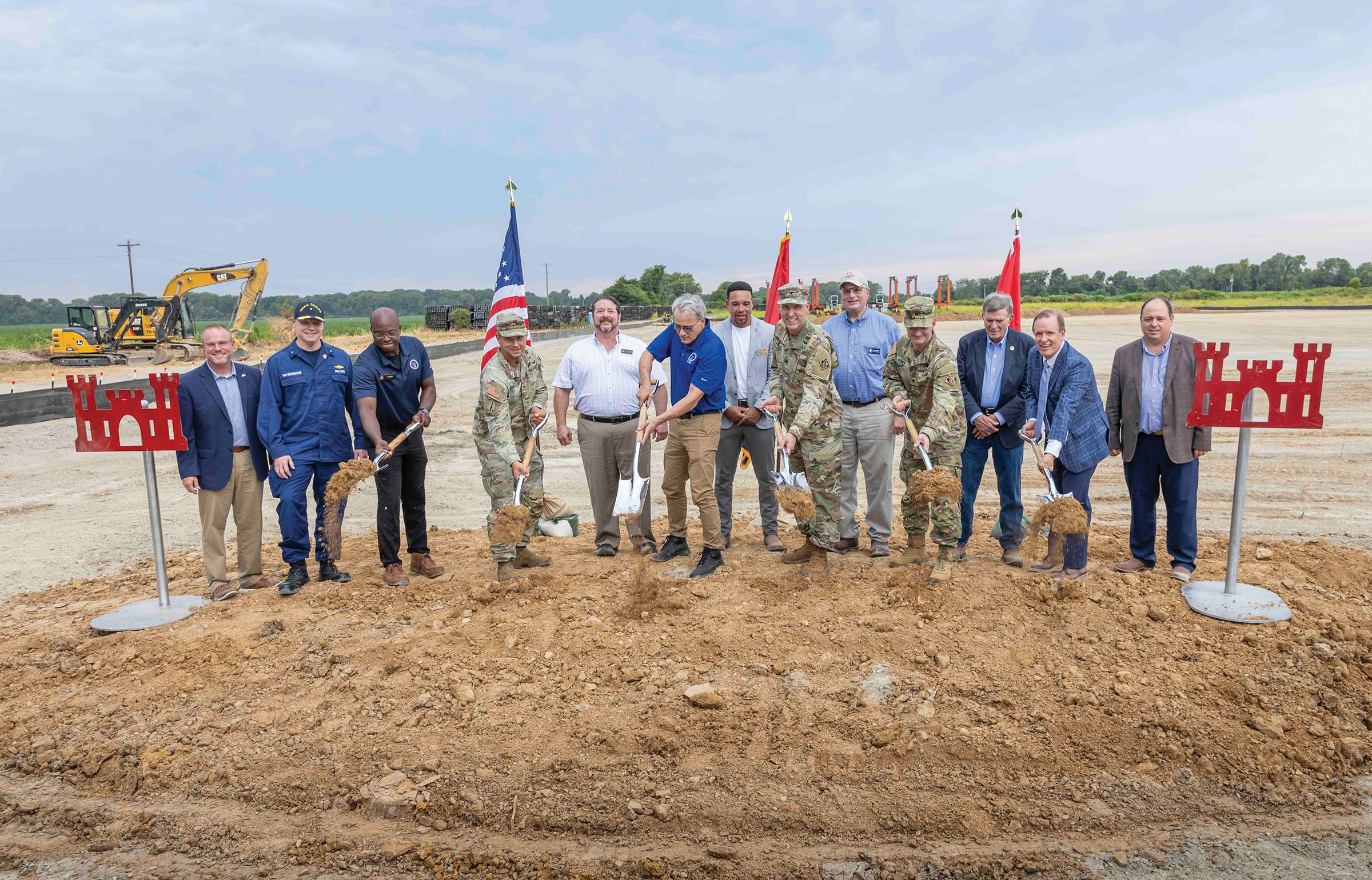Dignitaries at the August 18 groundbreaking ceremony for the new automated casting facility prepare to ceremonially turn the first shovels of dirt. It will produce articulated concrete mattress for armoring the banks of the Mississippi River to prevent erosion. (Photo courtesy of Memphis Engineer District)