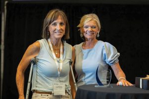Aimee Andres, right, executive director of IRPT, presents Lucy Fletcher of AGRIServices of Brunswick with a 2026 IRPT Cargo Award on the second day of the conference.