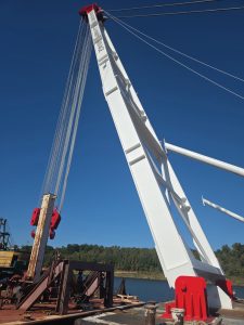Big Rick’s lifting wires and blocks are rigged for heavy lifts. During barge recoveries, crews work to position lifting wires beneath the hull while limiting the need for divers in the water.